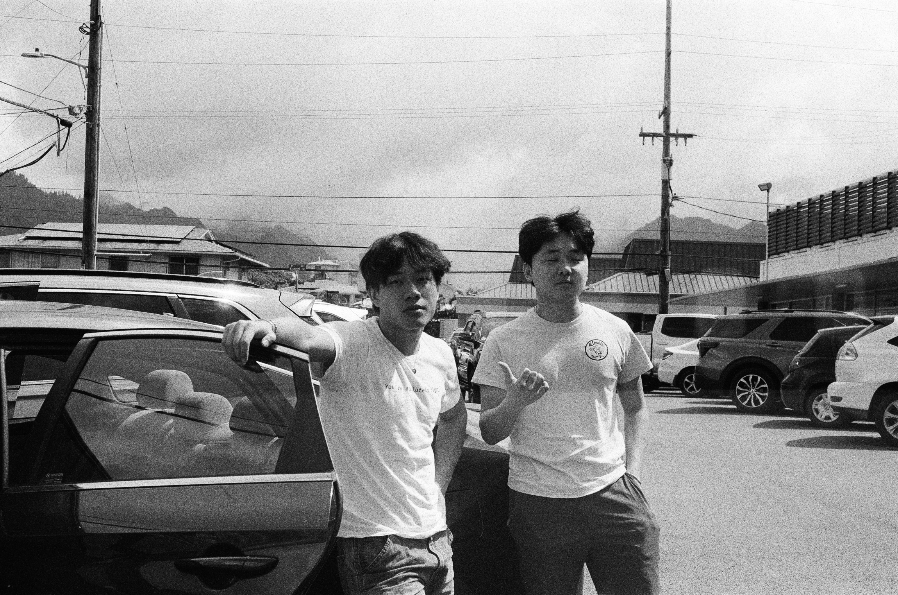 two friends in a parking lot, Hawaii